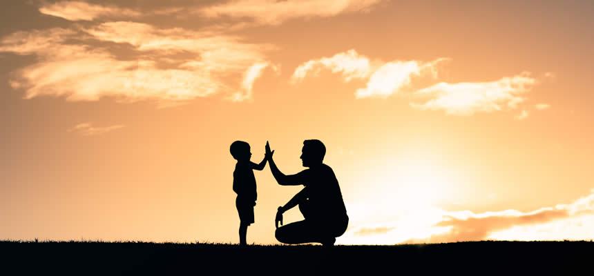 article photo of a father encouraging his young son while outdoors by Dr. Sam Goldstein